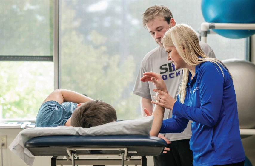 Student assisting with Physical Therapy