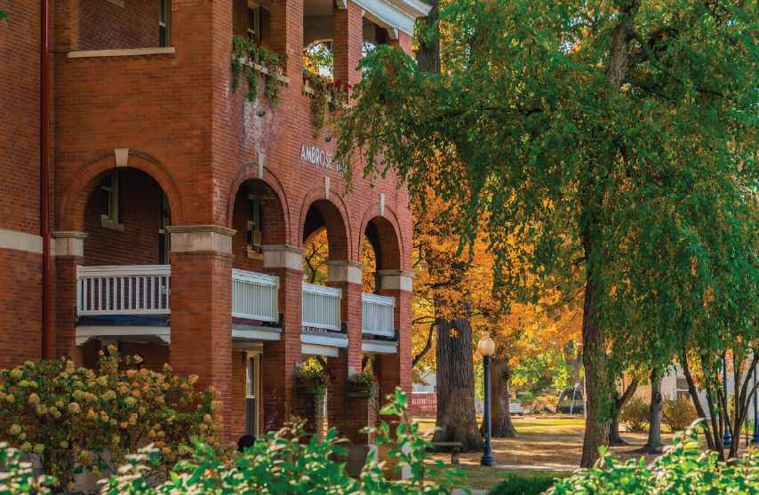 A photo of Ambrose Hall surrounded by trees