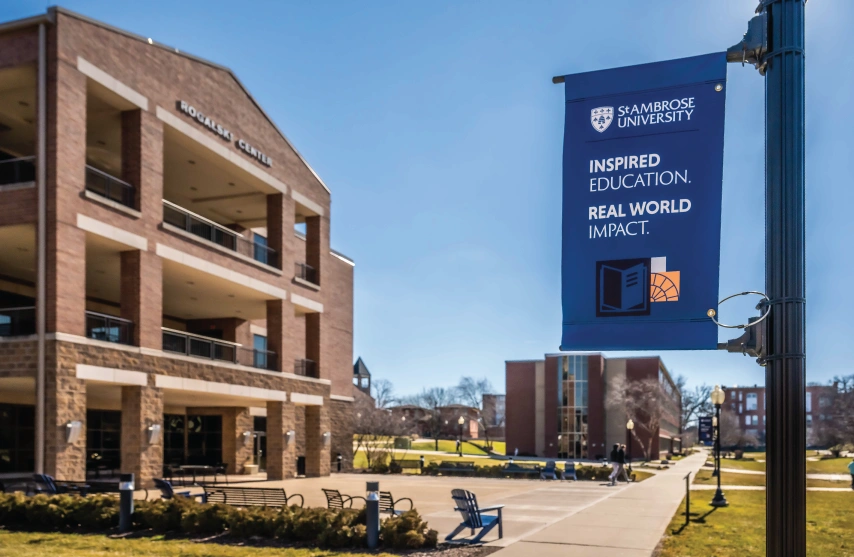 Exterior of the Rogalski Center on a sunny day, with flag reading: 