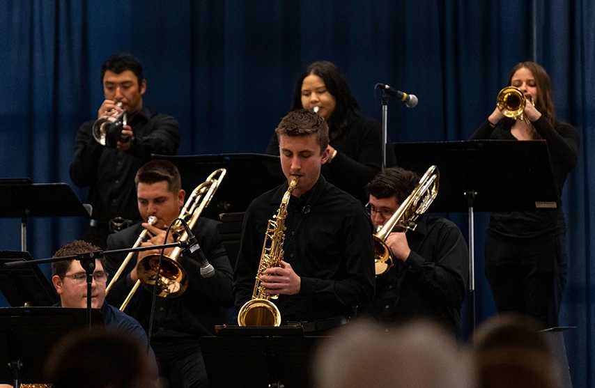 Students play instruments.