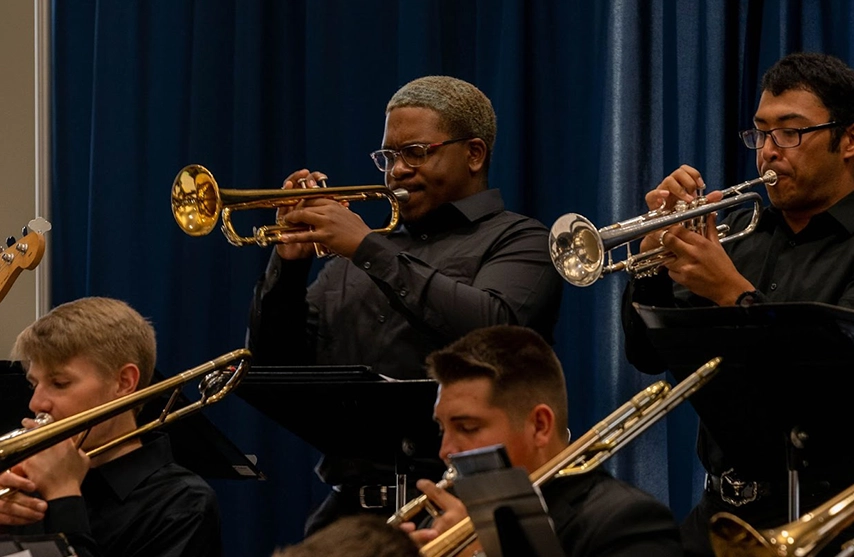 Students play instruments.