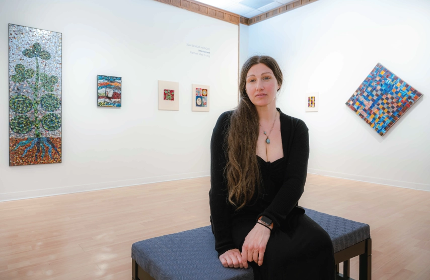 A woman sitting in an art gallery.