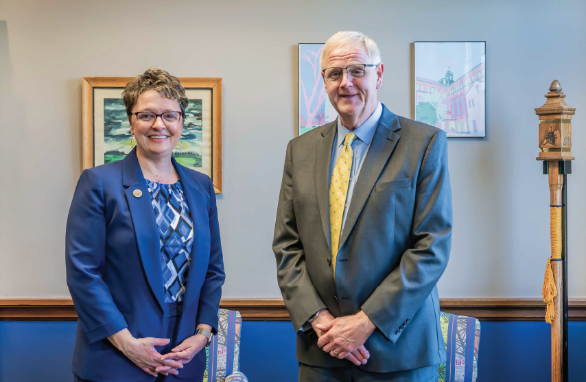 Presidents of St. Ambrose University and Mount Mercy University stand together in office.