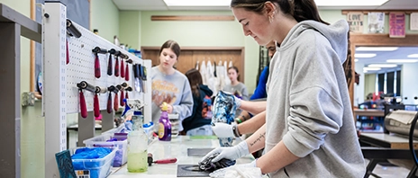 Students work on print making at St. Ambrose University while taking part in a newly launched core curriculum.