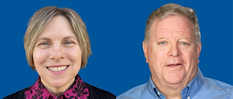 Ann Schwickerath ’98 and Raymond “Ray” James Shovlain ’79, ’82 MBA smile into the camera against a blue background with text that reads their names underneath.