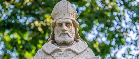 A photo of the statue of St. Ambrose on the campus of St. Ambrose University in Davenport, IA.