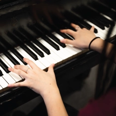 The hands of a musician playing piano.