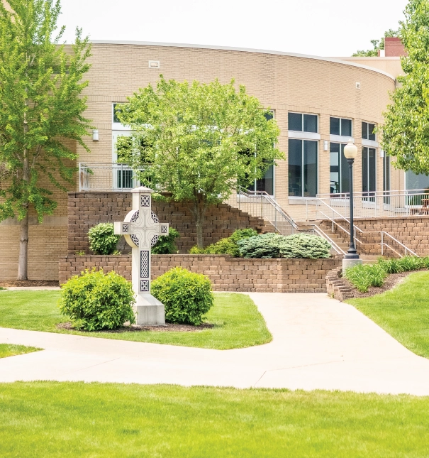 Exterior view of the chapel featuring a cross.