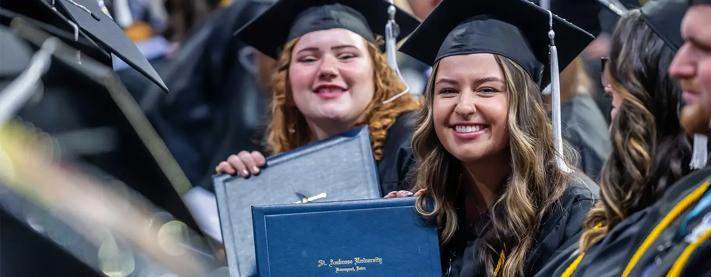 Happy graduates stand together for a photo during their commencement celebration.