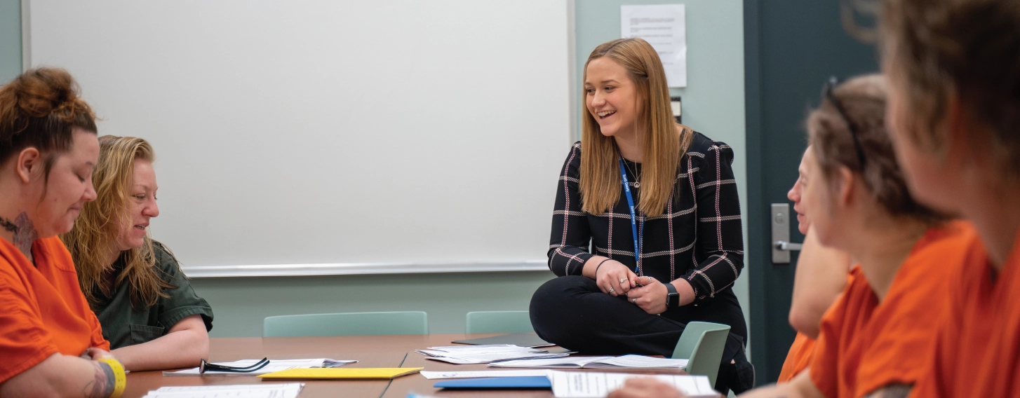 Forensic psychology student leading a group in a local jail setting.