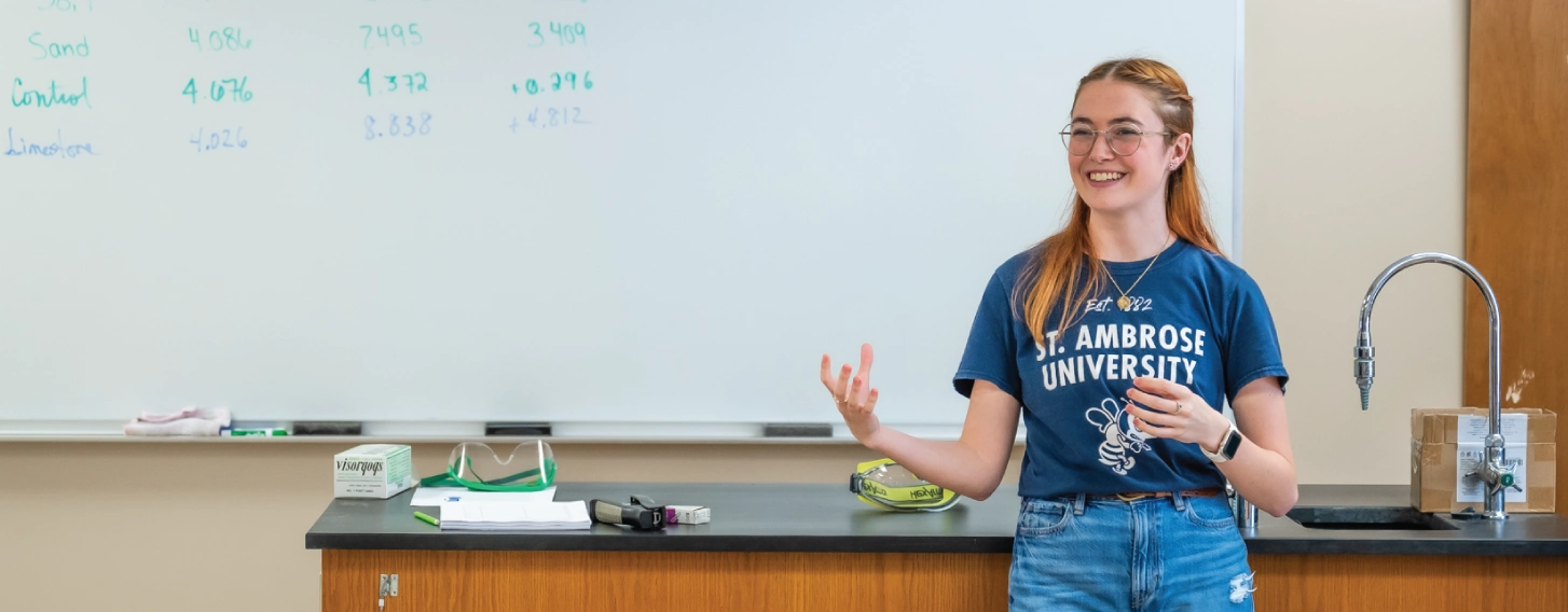 Student teaching in chemistry classroom.