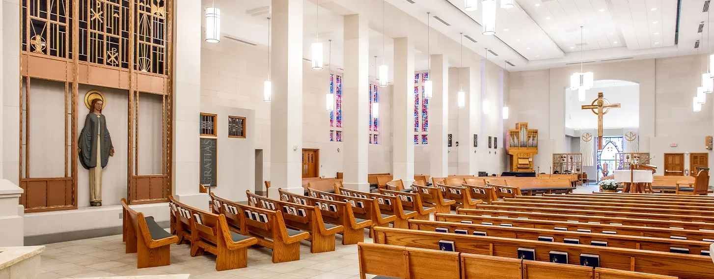 An interior view of the pews of the Christ the King Chapel.