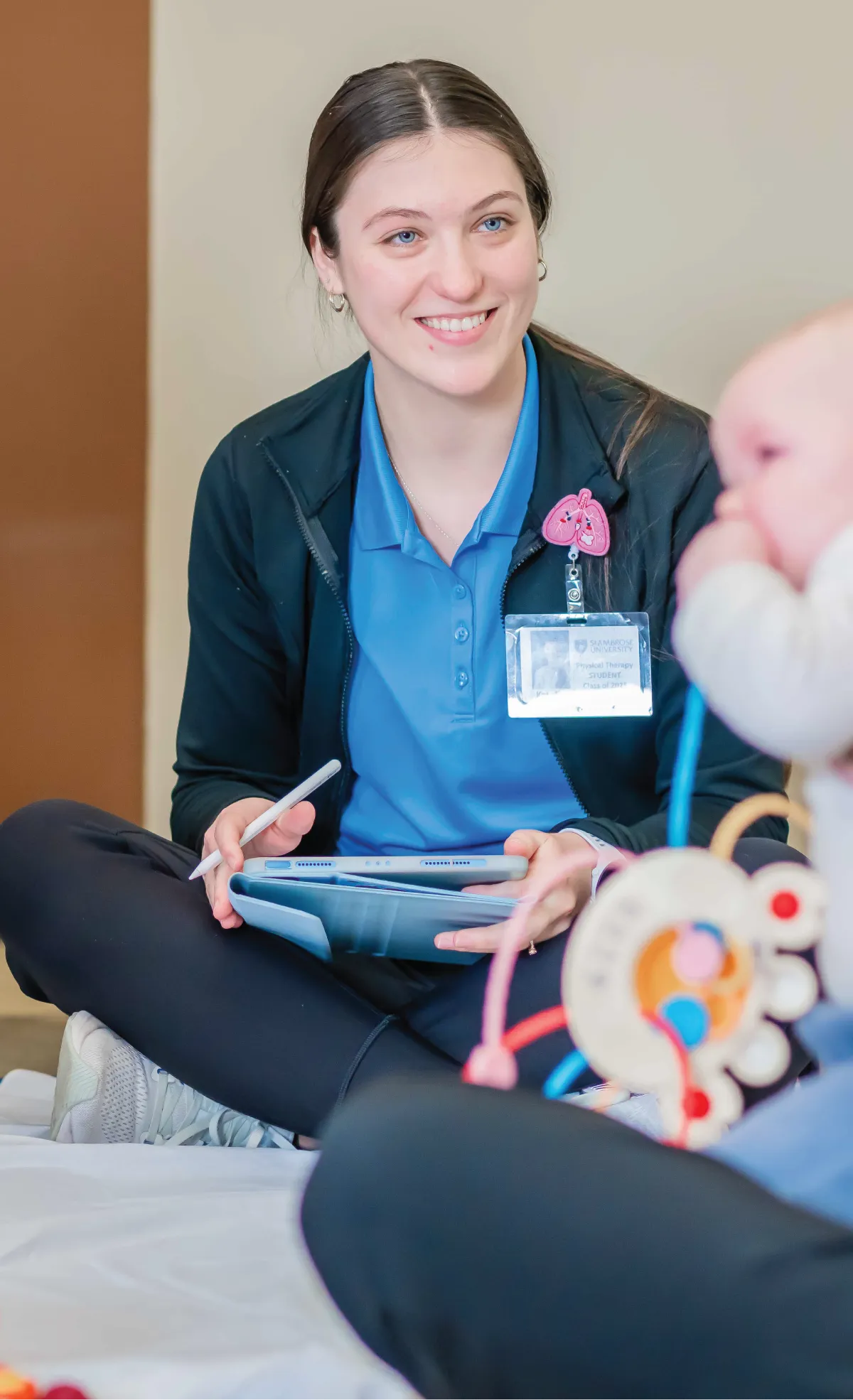Transfer student smiling in classroom.