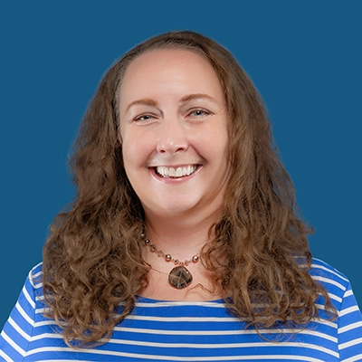 Megan Cox smiles into the camera.