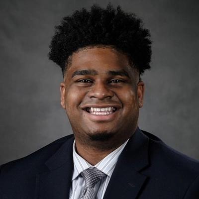 Ty Lewis smiles into the camera.