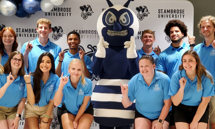 Group of students with barney the bee mascot